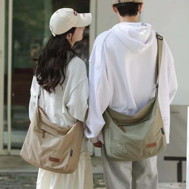 Japanese Lifestyle Books - 日本人女性男性ショルダークロスボディバッグ大型キャンバスメッセンジャーバッグ学生 2024 ブランドブックバッグ女性のハンドバッグかばん